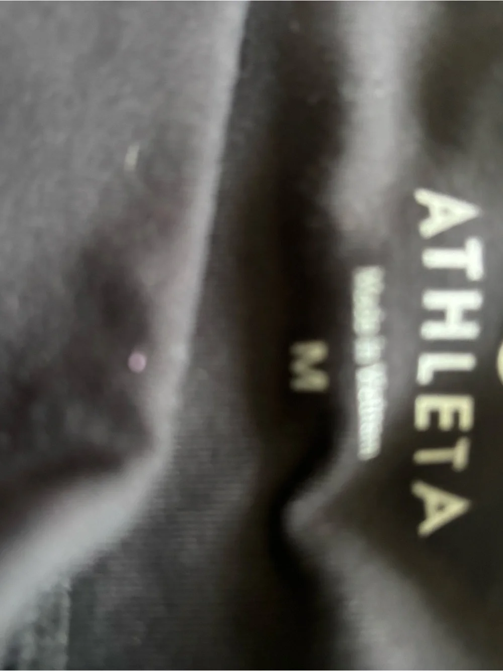 Athleta Black Performance Top with Subtle Purple Accent